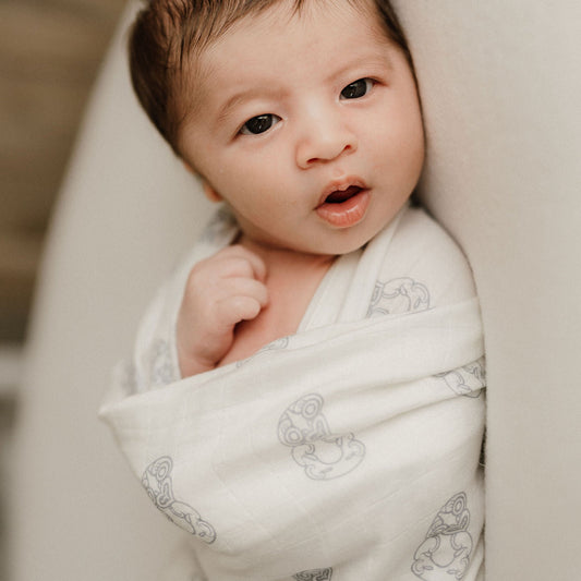 Māori baby, maori, cultural baby, baby wrap, pepe wrap, pēpi wrap, swaddle, feeding cover, nursing cover, shade cloth, baby shade cloth, light baby blanket, bamboo and cotton blend, cultural baby, burp cloth, Māori pēpi wrap, Tiki, Tiki baby