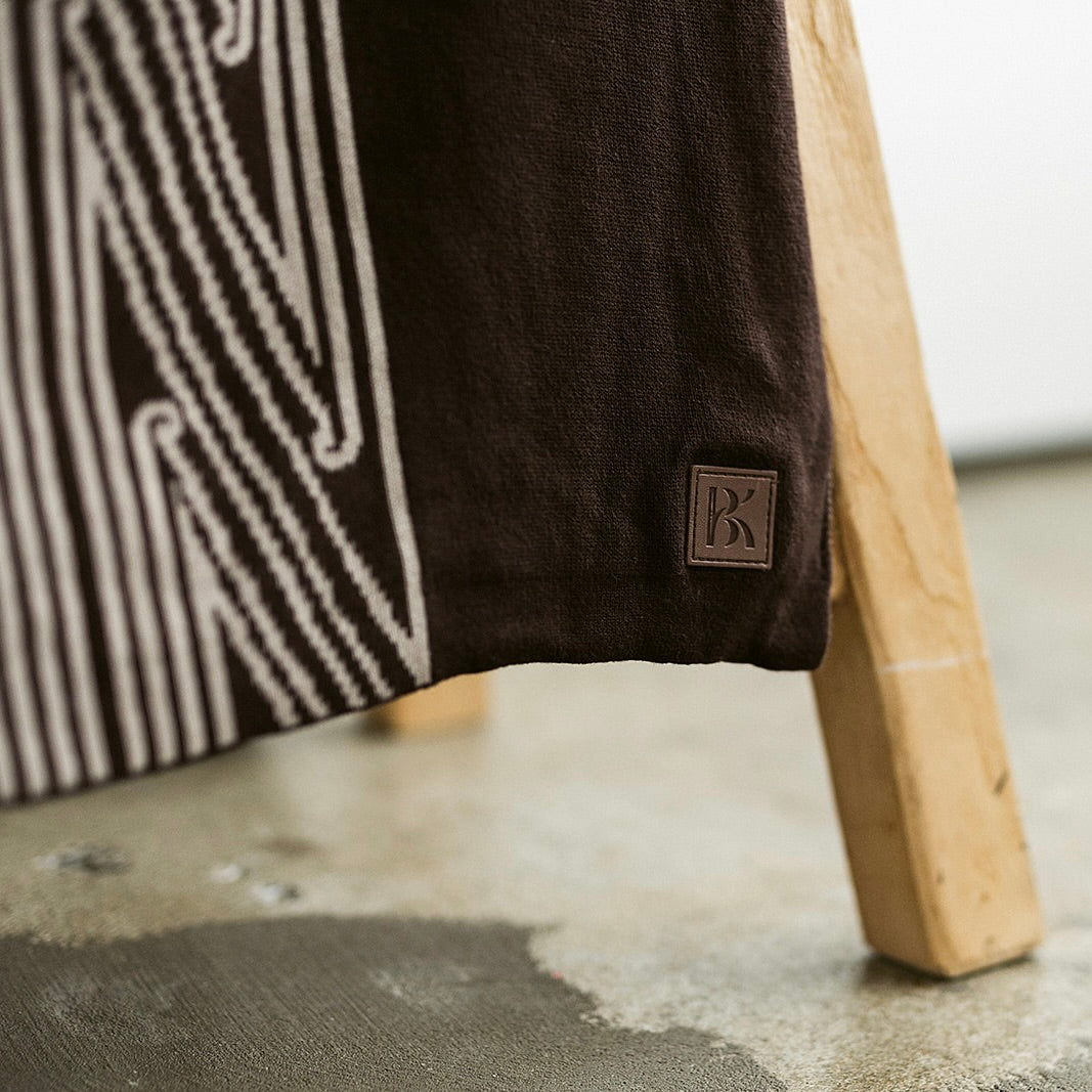 Throw blanket, sofa throw, decorative blanket, home textile, Māori-inspired design, Māori patterns, geometric motifs, koru patterns, earthy tones, brown and beige, natural colours, vibrant colours, Contemporary, minimalist, statement piece, cultural design, Living room décor, sofa styling, cosy home, bedroom styling, commercial gifting, gift box, māori, maori, premium throw blanket, Māori paraikete, authentic Māori, whare, kāinga