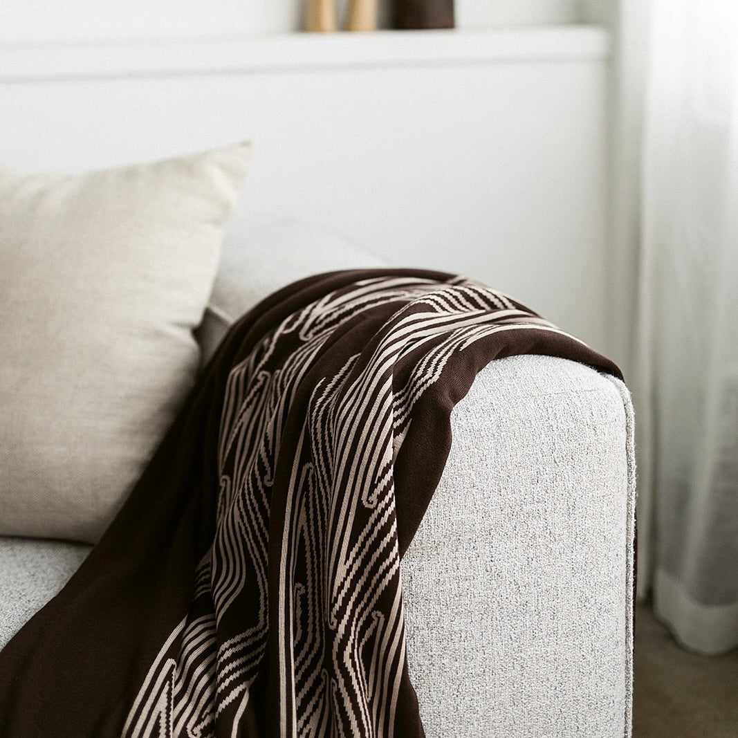 Throw blanket, sofa throw, decorative blanket, home textile, Māori-inspired design, Māori patterns, geometric motifs, koru patterns, earthy tones, brown and beige, natural colours, vibrant colours, Contemporary, minimalist, statement piece, cultural design, Living room décor, sofa styling, cosy home, bedroom styling, commercial gifting, gift box, māori, maori, premium throw blanket, Māori paraikete, authentic Māori, whare, kāinga